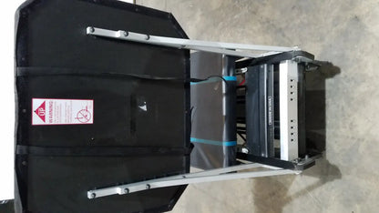 Black padded flight case with silver metal frame blue straps and warning label for shuttle recovery sport product