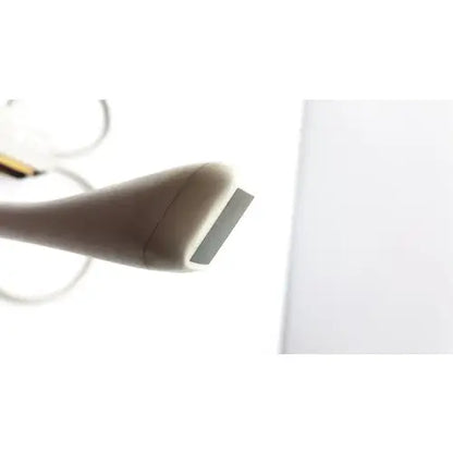 Beige handheld epilator with sleek ergonomic design and metallic head for siemens acuson ev7 linear probe use