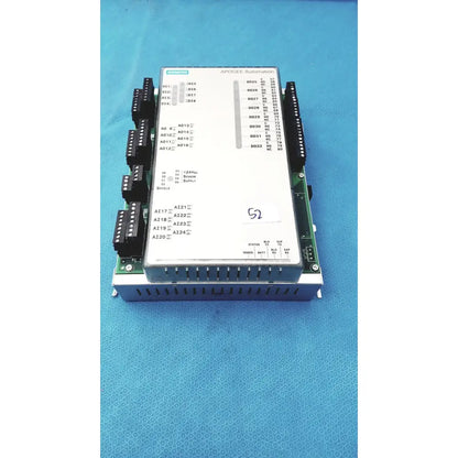 Siemens apogee automation 549-627 1210 modular equipment controller with white front panel and green circuit board