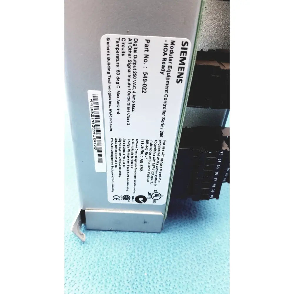 Gray siemens apogee automation modular equipment controller with black terminal blocks and white technical label