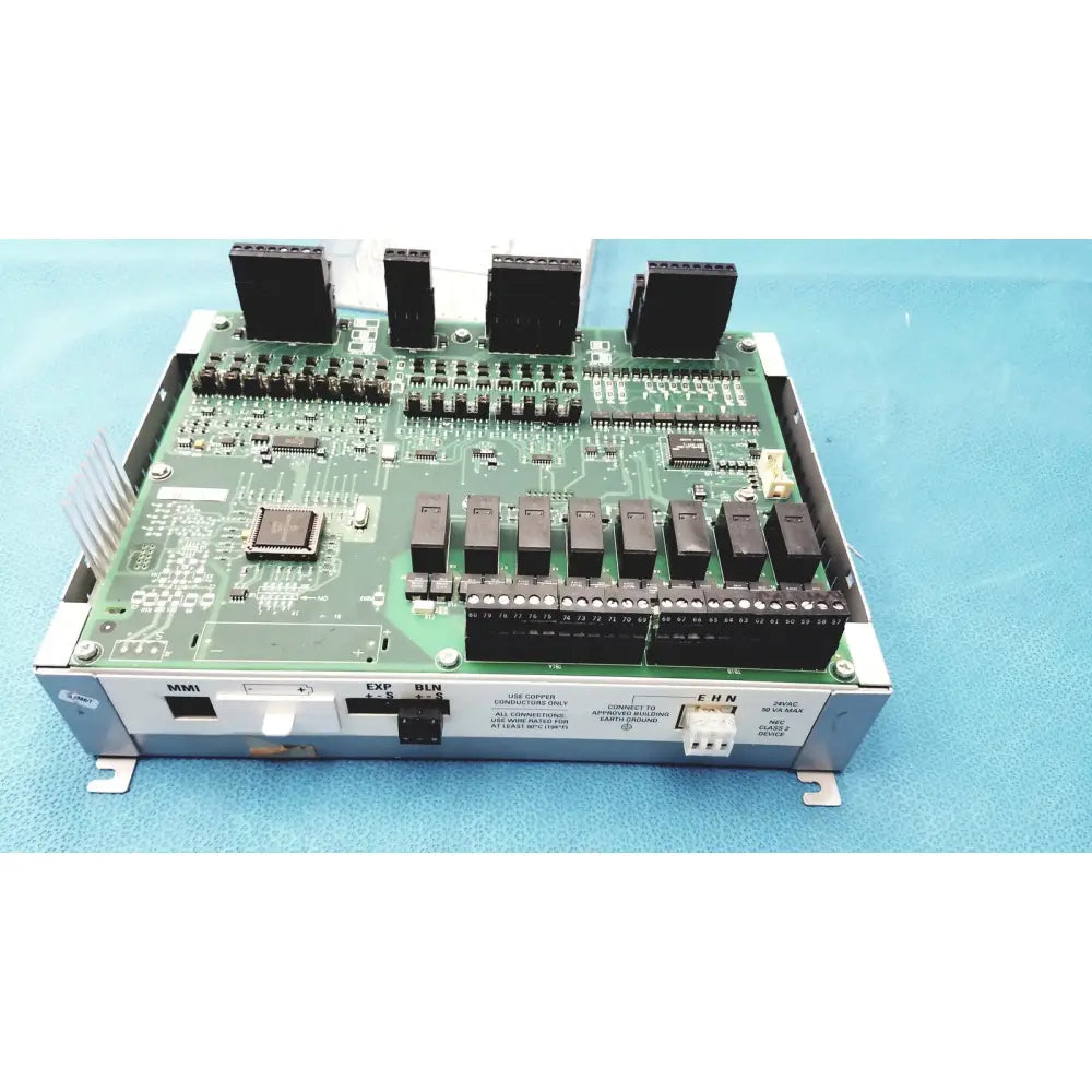 Green circuit board with black connectors and components in silver metal casing for siemens apogee automation controller