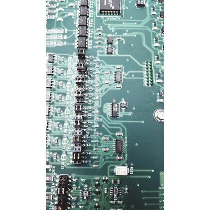 Green printed circuit board with black integrated circuits and connectors of siemens apogee automation 549-627 1210 controller