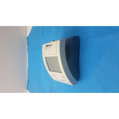 White and gray handheld siemens clinitek status urine analyzer with screen, buttons, and test strip slot for diagnostic use