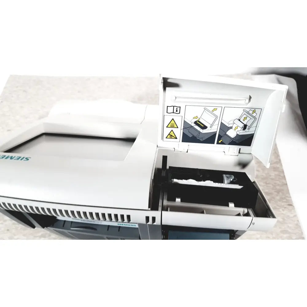 White siemens dca vantage analyzer with hinged lid open showing internal components and instructional diagrams