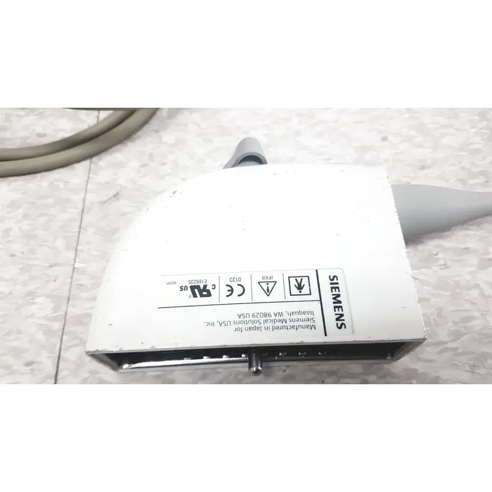 White siemens ev9-4 endocavity ultrasound transducer probe housing with gray cable connections and regulatory labels shown from back side