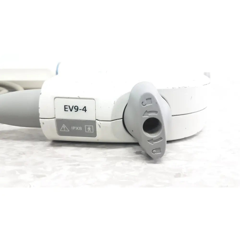 White and gray siemens ev9-4 endocavity ultrasound transducer probe showing circular port cover with directional arrows