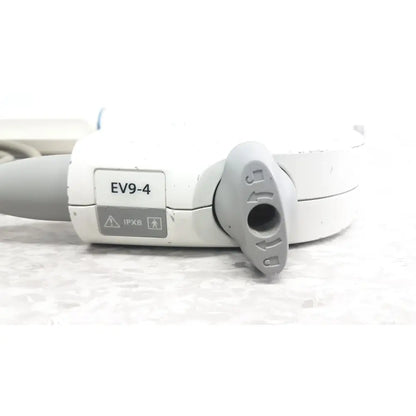 White and gray siemens ev9-4 endocavity ultrasound transducer probe showing circular port cover with directional arrows