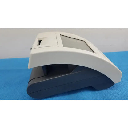 Siemens healthcare clinitek status white and black plastic cash register with integrated display screen and curved top housing