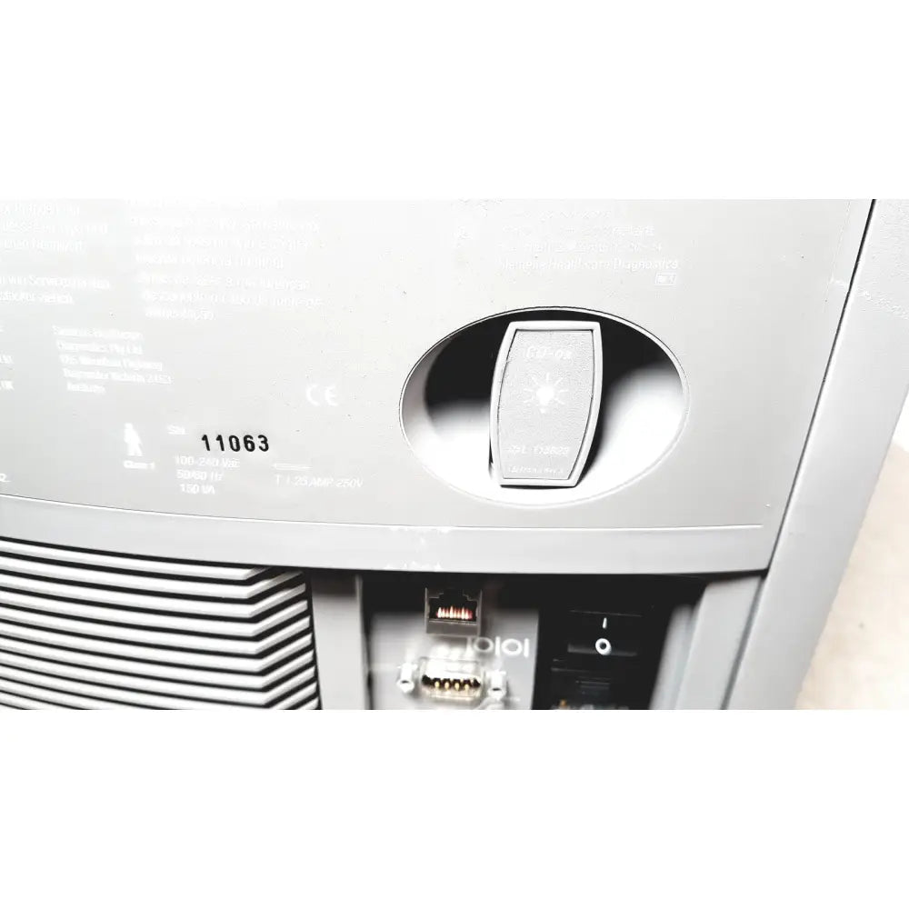 Gray plastic power switch with light bulb icon on the back panel of siemens rapidpoint 400 405 series system for reuse medical