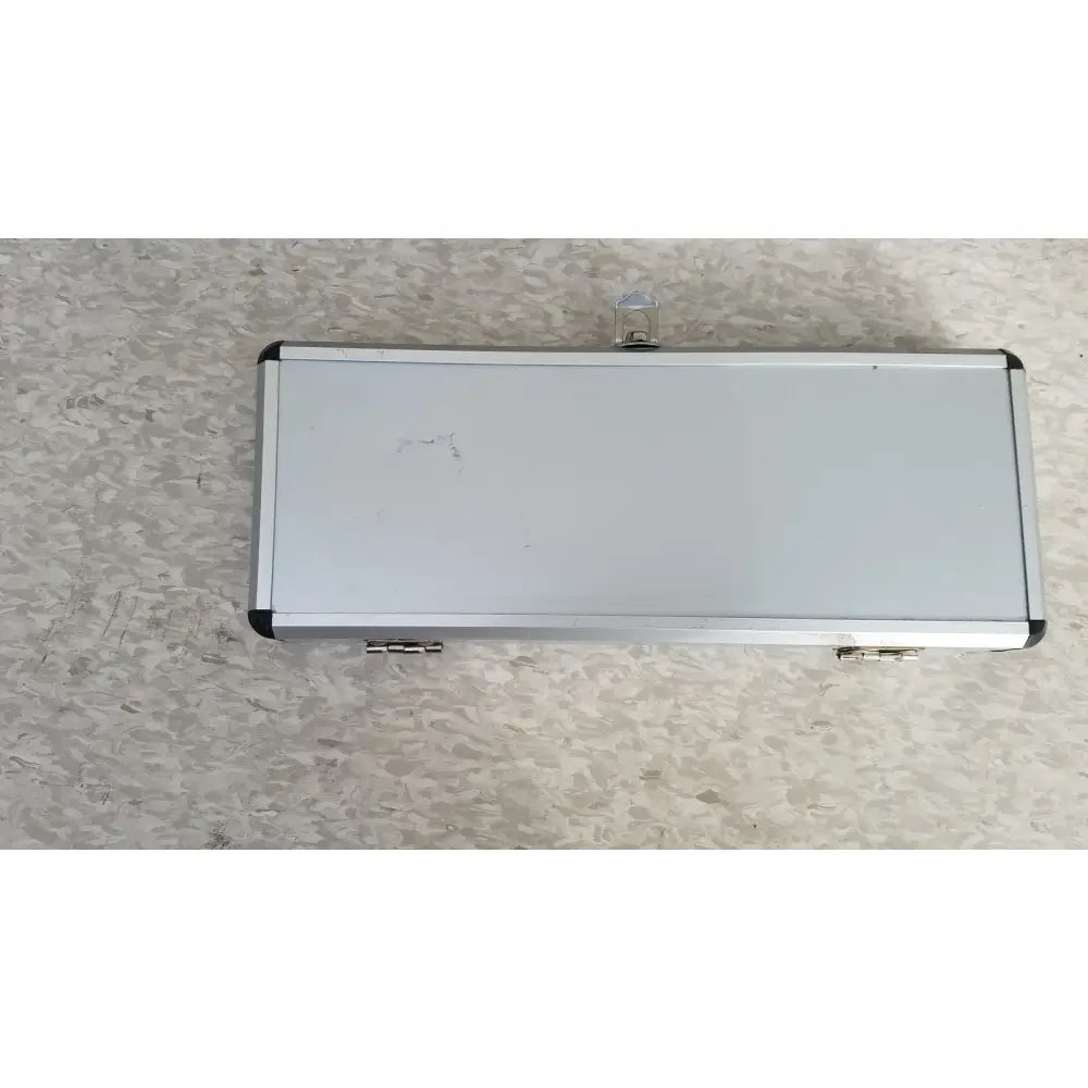 Silver hard protective aluminum tool case with black corner accents and a small transparent latch