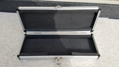 Silver hard protective aluminum instrument case with black foam interior for secure storage and transport