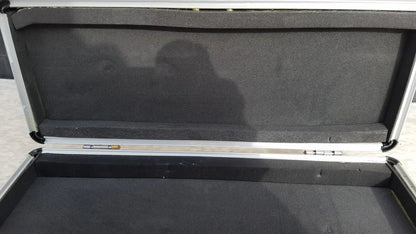 Silver hard protective flight case with aluminum exterior and black foam interior for secure equipment storage