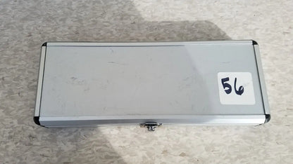 Silver hard protective aluminum case with small lock and white sticker number 56 for secure storage