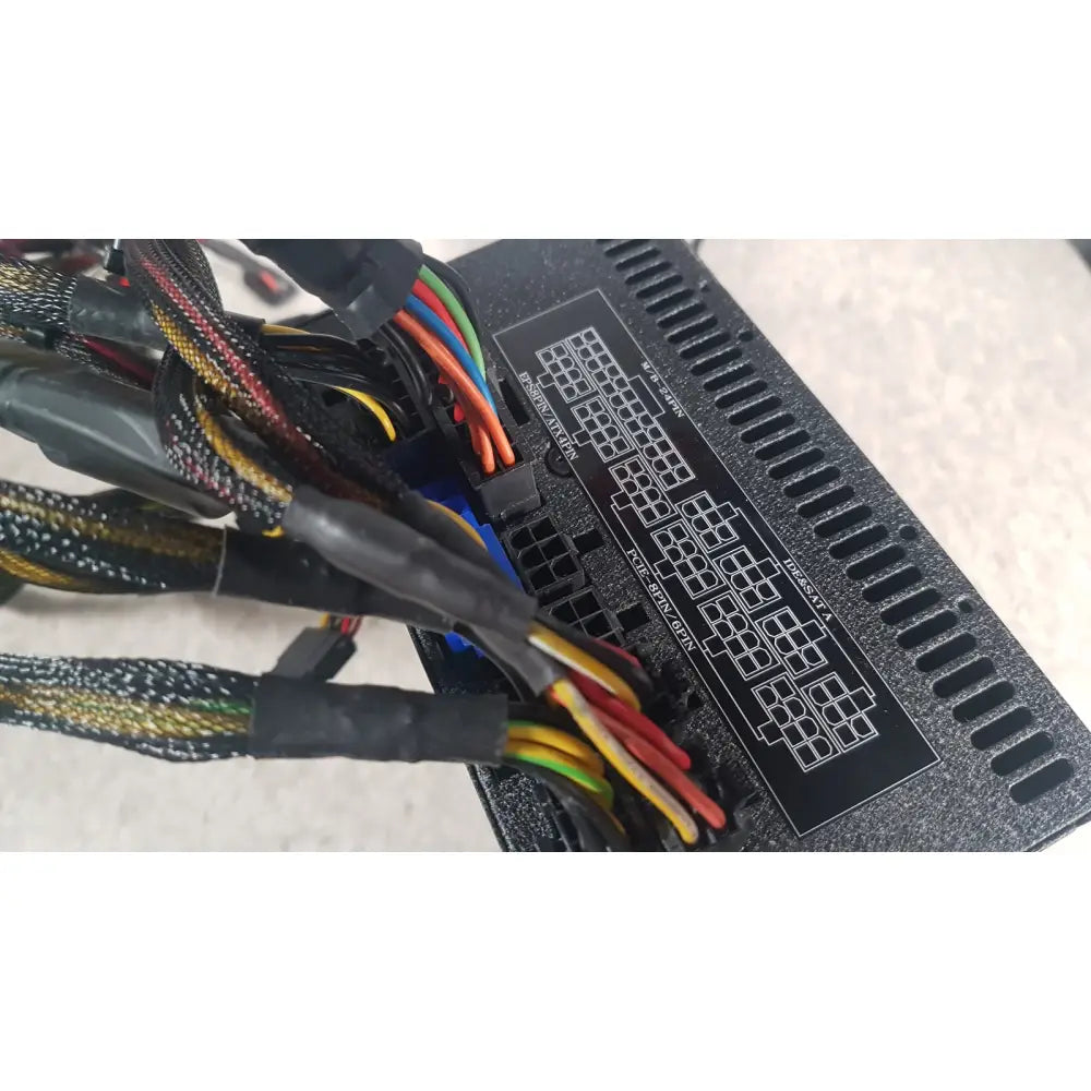 Black textured silverstone 1200w strider gold power supply unit with labeled connector panel and bundled colorful cables