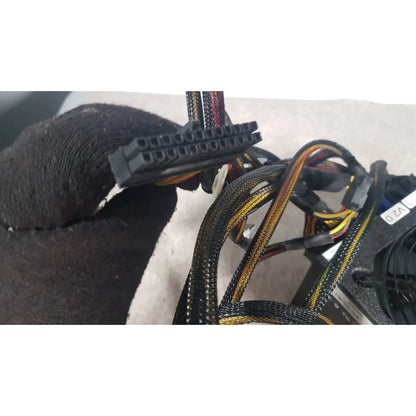 Black plastic 24-pin power connector with color-coded wires on silverstone 1200w strider gold power supply