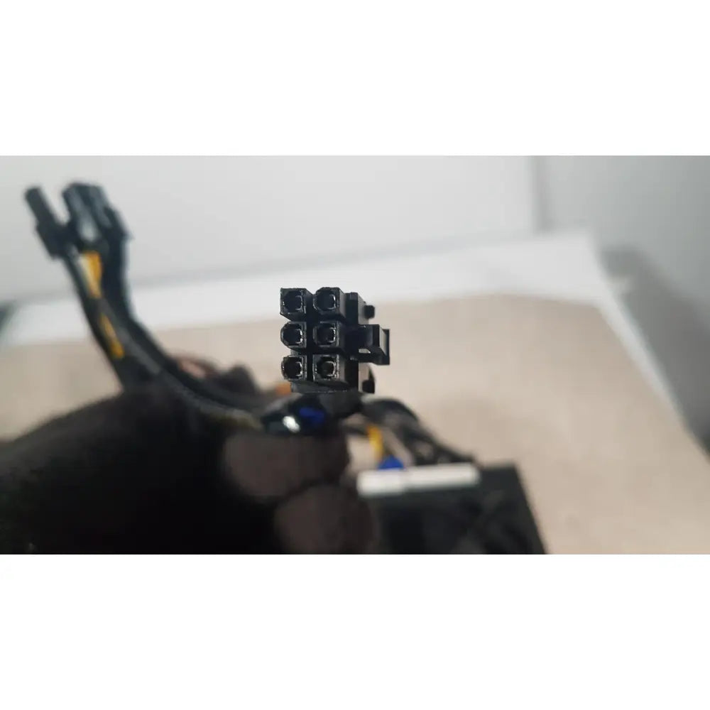 Black plastic 8-pin pcie power connector with yellow and black cables for SilverStone 1200w strider gold power supply