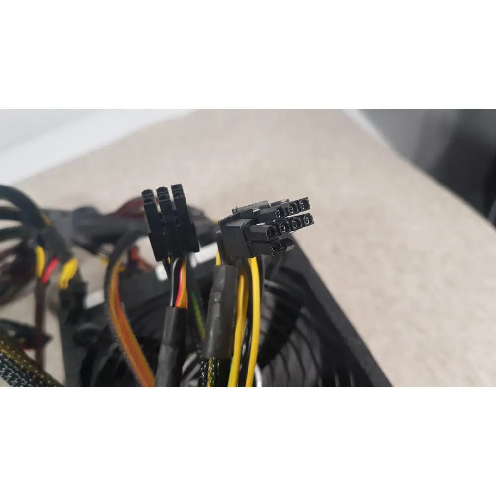 Black plastic power connector with multiple pins and color-coded wires for silverstone 1200w strider gold power supply