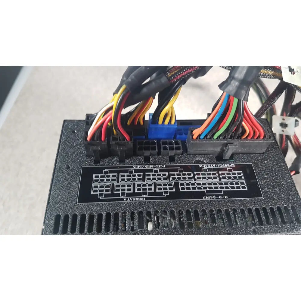 Black SilverStone 1200w Strider gold power supply unit with colorful cables and a blue connector visible