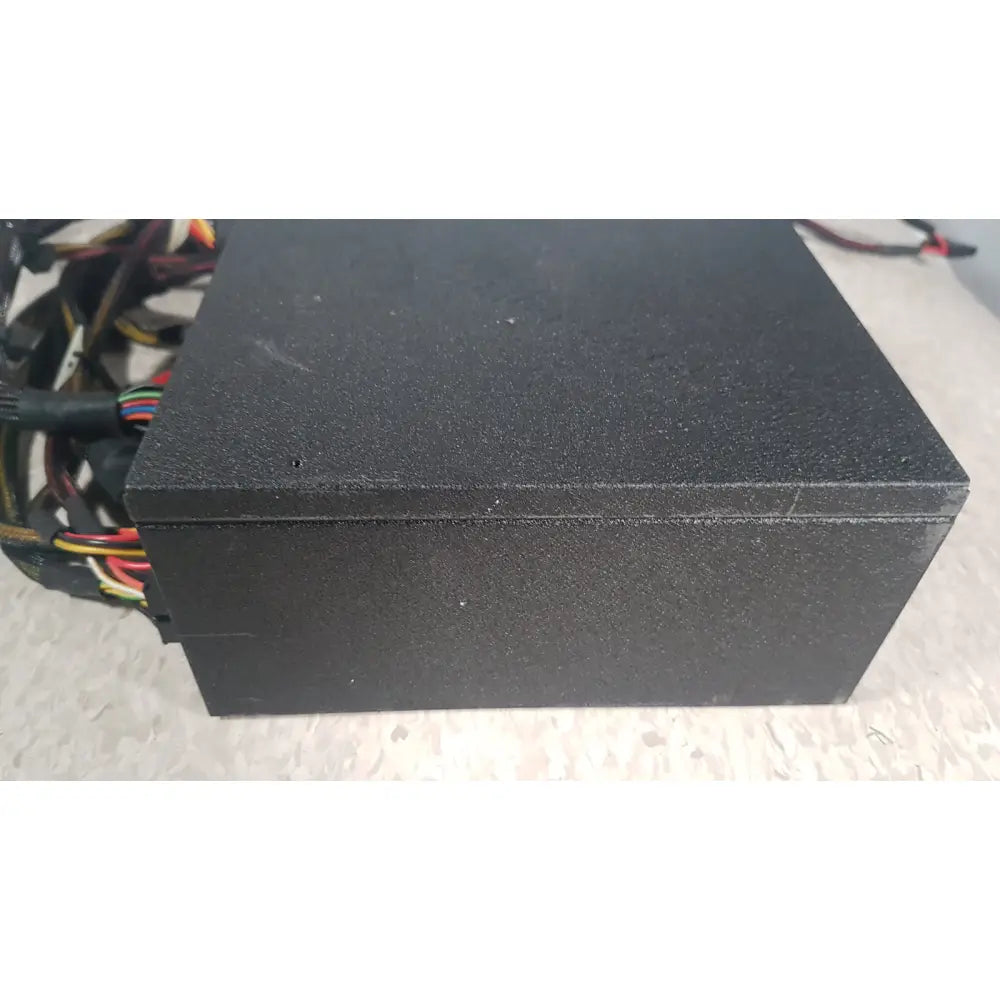 Black textured SilverStone 1200w Strider Gold power supply unit with visible cables and connectors for PC use