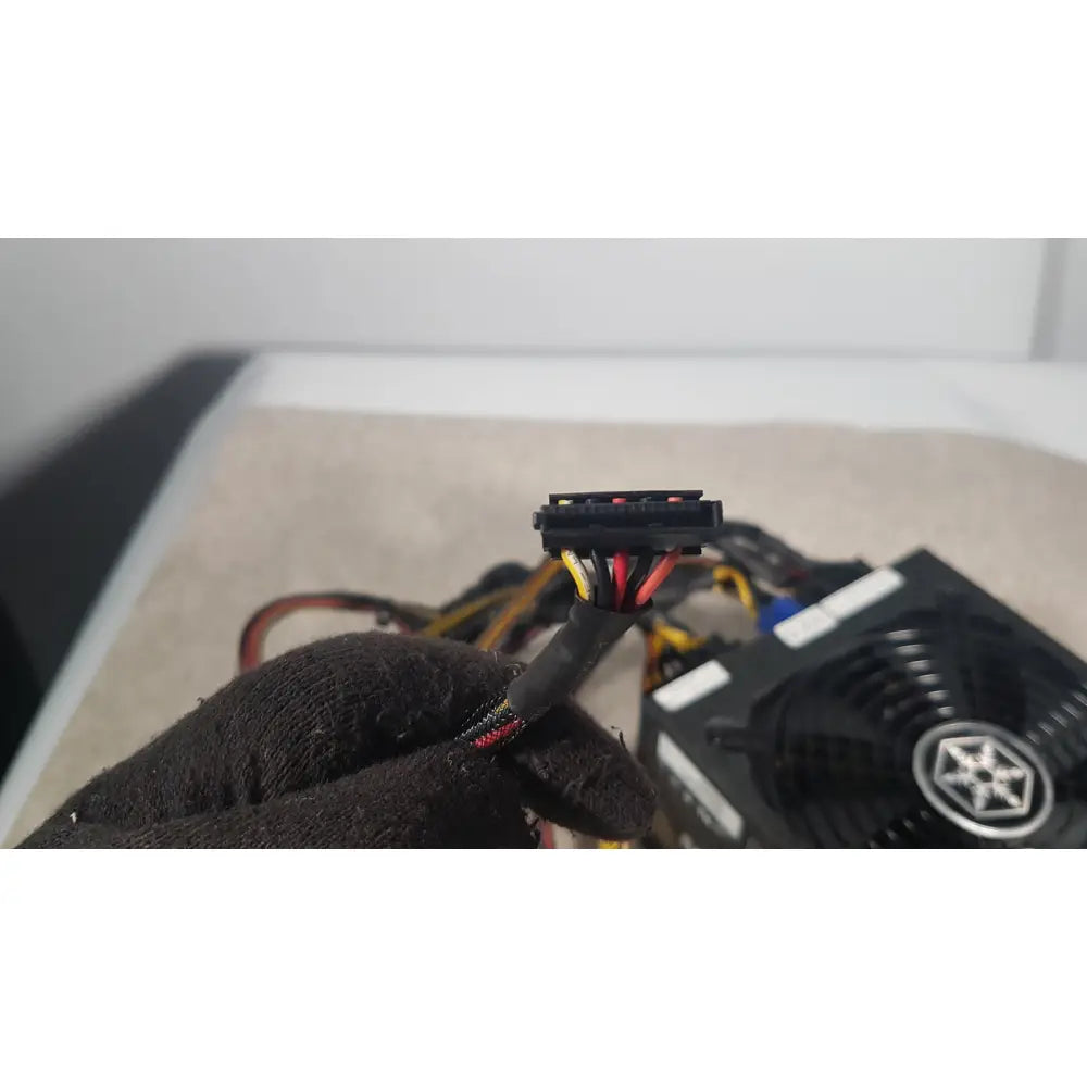 Black plastic 6-pin pcie power connector with color-coded wires of silverstone 1200w strider gold power supply