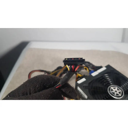 Black plastic 6-pin pcie power connector with color-coded wires of silverstone 1200w strider gold power supply
