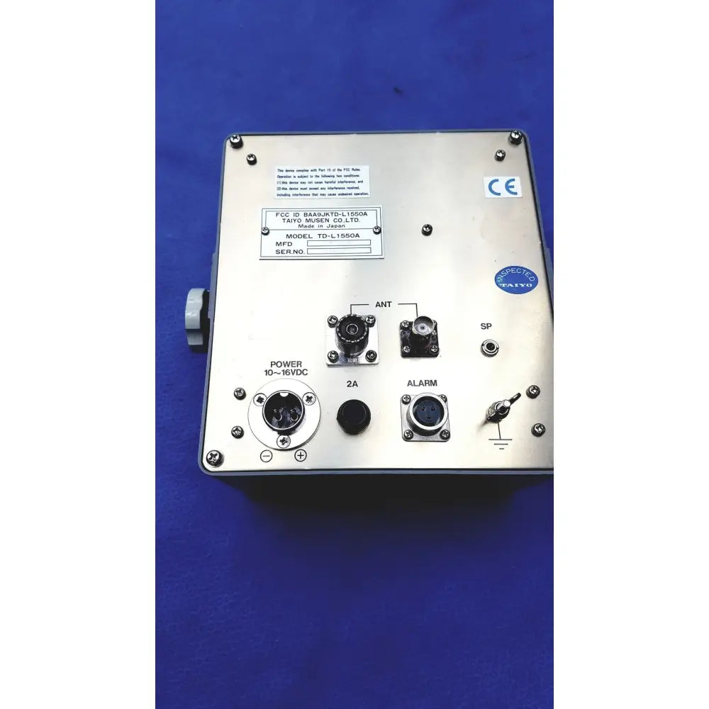 Silver metallic industrial control panel with labeled ports and switches on simrad taiyo synthesized vhf automatic device