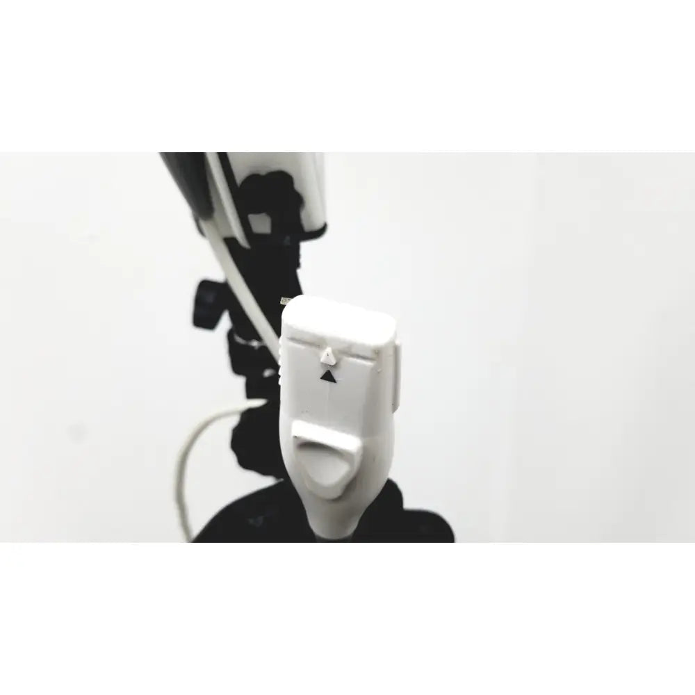 White plastic camera remote shutter release with black triangular buttons for site rite prevue ultrasound system use
