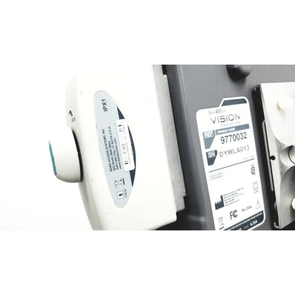 White plastic site rite vision medical device with gray label showing product code and serial number on ultrasound system back
