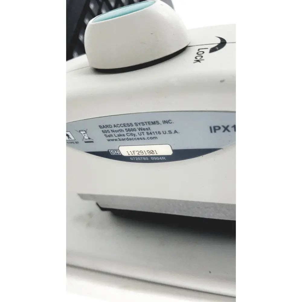 White plastic site rite vision ultrasound system device with teal knob and black lock label by bard access systems