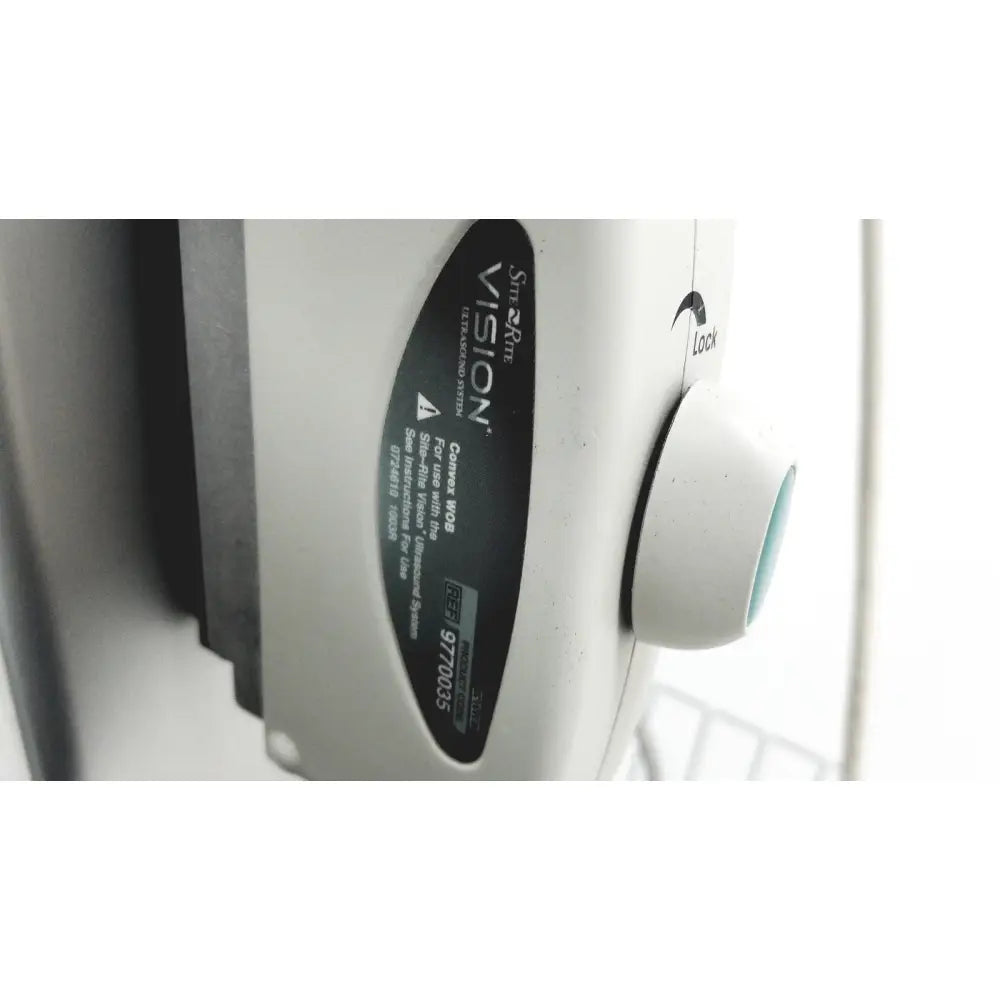 White plastic simarte vision corvus wob camera with black label and teal lock knob on site rite vision ultrasound system with cart