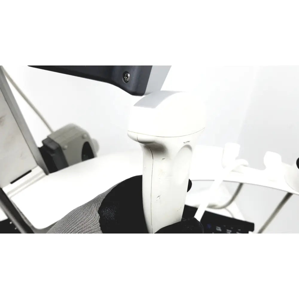 White ergonomic handheld scanner with matte finish and integrated grip in site rite vision ultrasound system 9770032