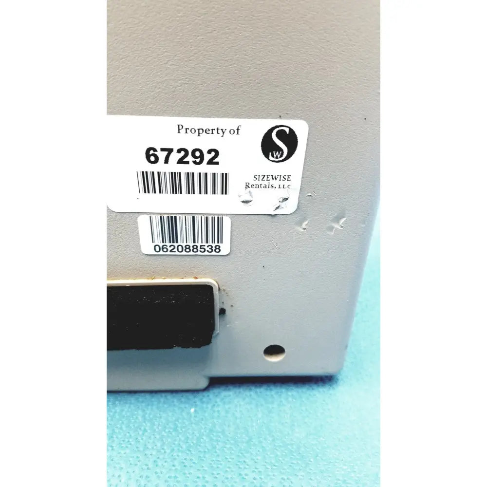 Gray metallic sizewise medical equipment air pump with black magnetic strip and two white rental labels from sizewise rentals llc