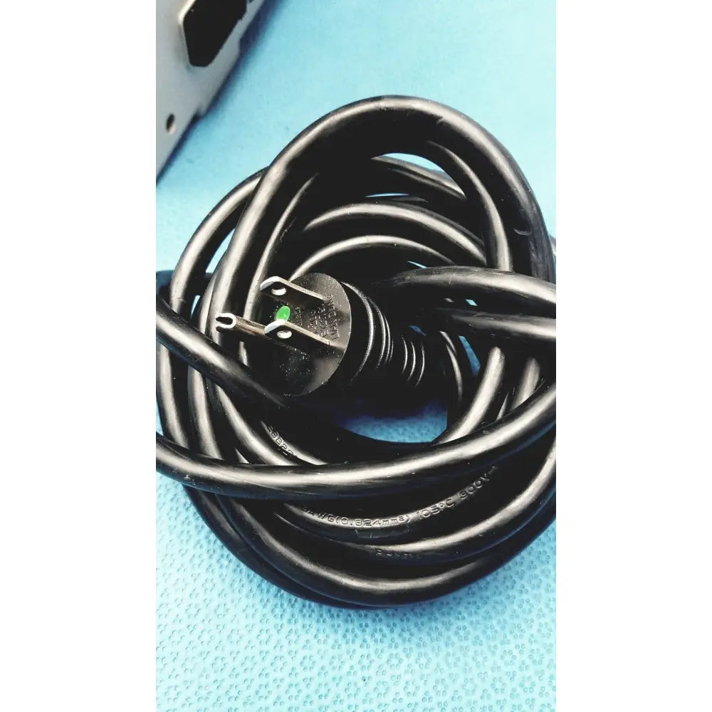 Black coiled power cord with three-prong plug and green grounding pin for sizewise medical equipment air pump