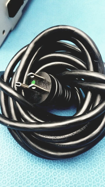 Black coiled power cord with three-prong plug and green grounding pin for sizewise medical equipment air pump