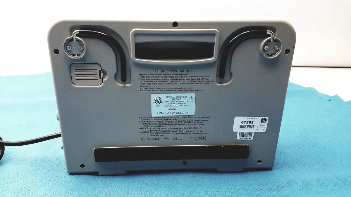 Gray plastic sizewise medical equipment air pump sw-ampmax-cp with black tubing and label showing operating instructions