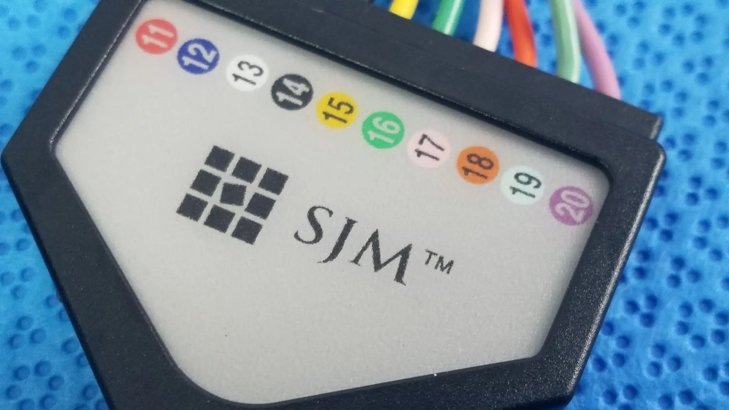Black plastic sjm st jude medical diagnostic connection cable with numbered colored connectors for reuse medical equipment