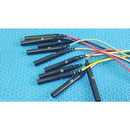Black ignition coils with numbered markings and colorful wiring on the back side of sjm st jude medical diagnostic connection cable for reuse medical equipment