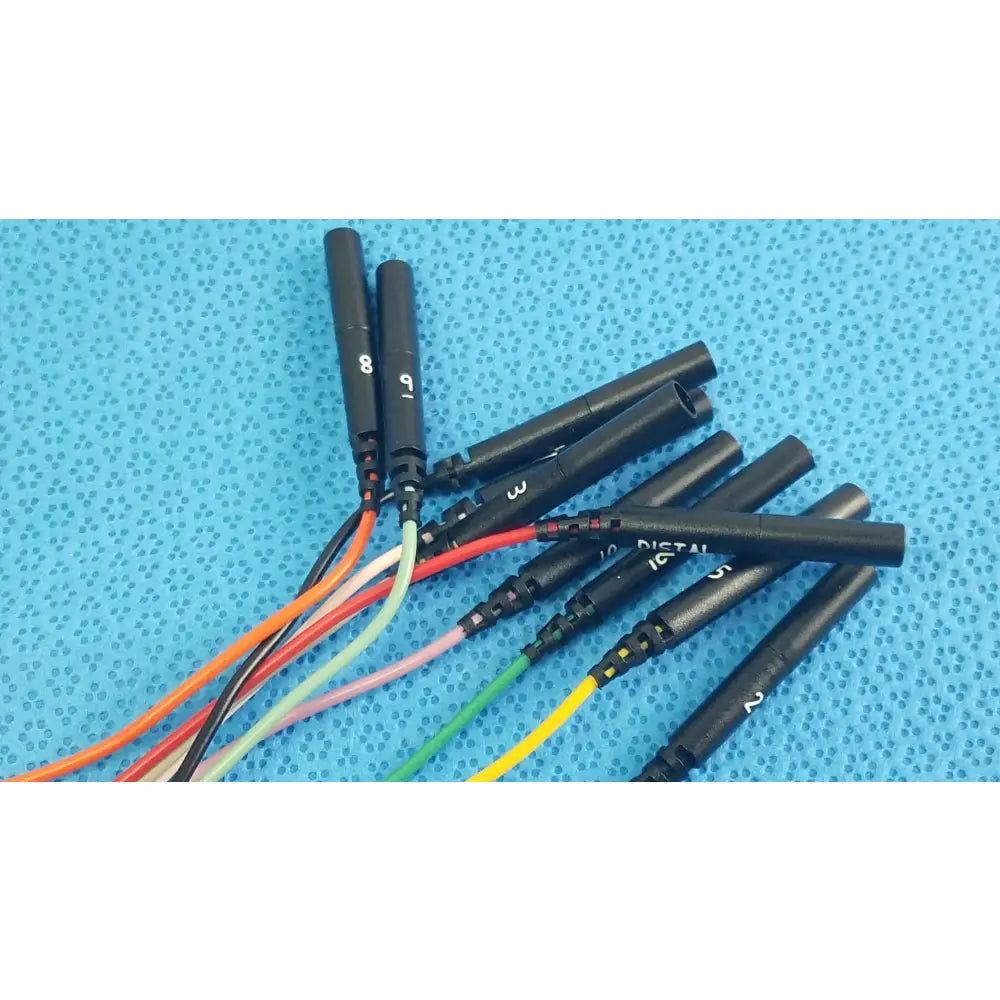 Black cylindrical connectors with numbered labels and colorful insulated wires on the reuse medical sjm st jude medical diagnostic connection cable