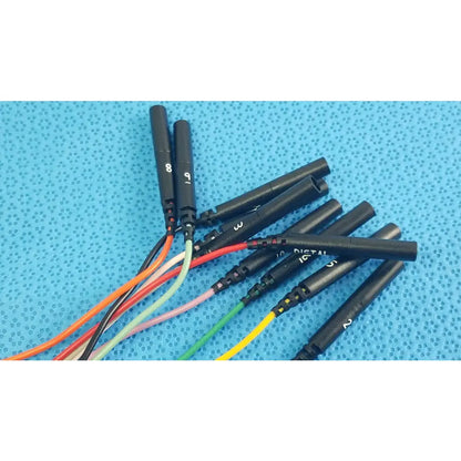 Black cylindrical connectors with numbered labels and colorful insulated wires on the reuse medical sjm st jude medical diagnostic connection cable