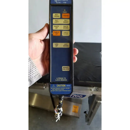 Blue skytron elite 1700 hand control with yellow and orange buttons for skytron 1700 surgical table medical equipment