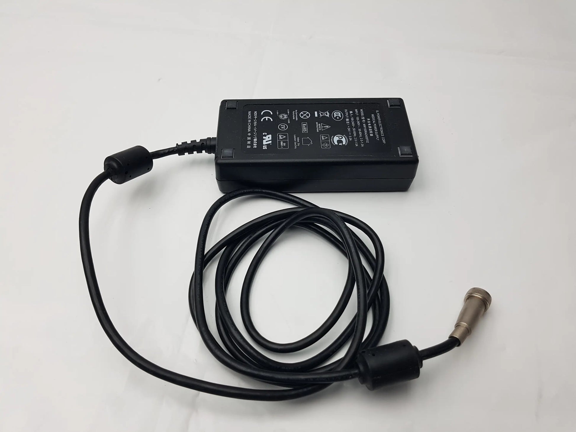 Black rectangular mw155ra2400f02 medical power supply with coiled cable and metallic connector by sl power electronics