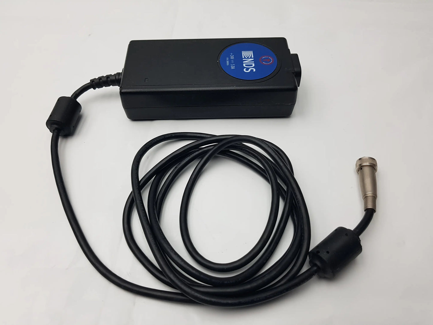 Black Philips NDS power supply with coiled cable and metallic connector for medical power supply MW155RA2400F02