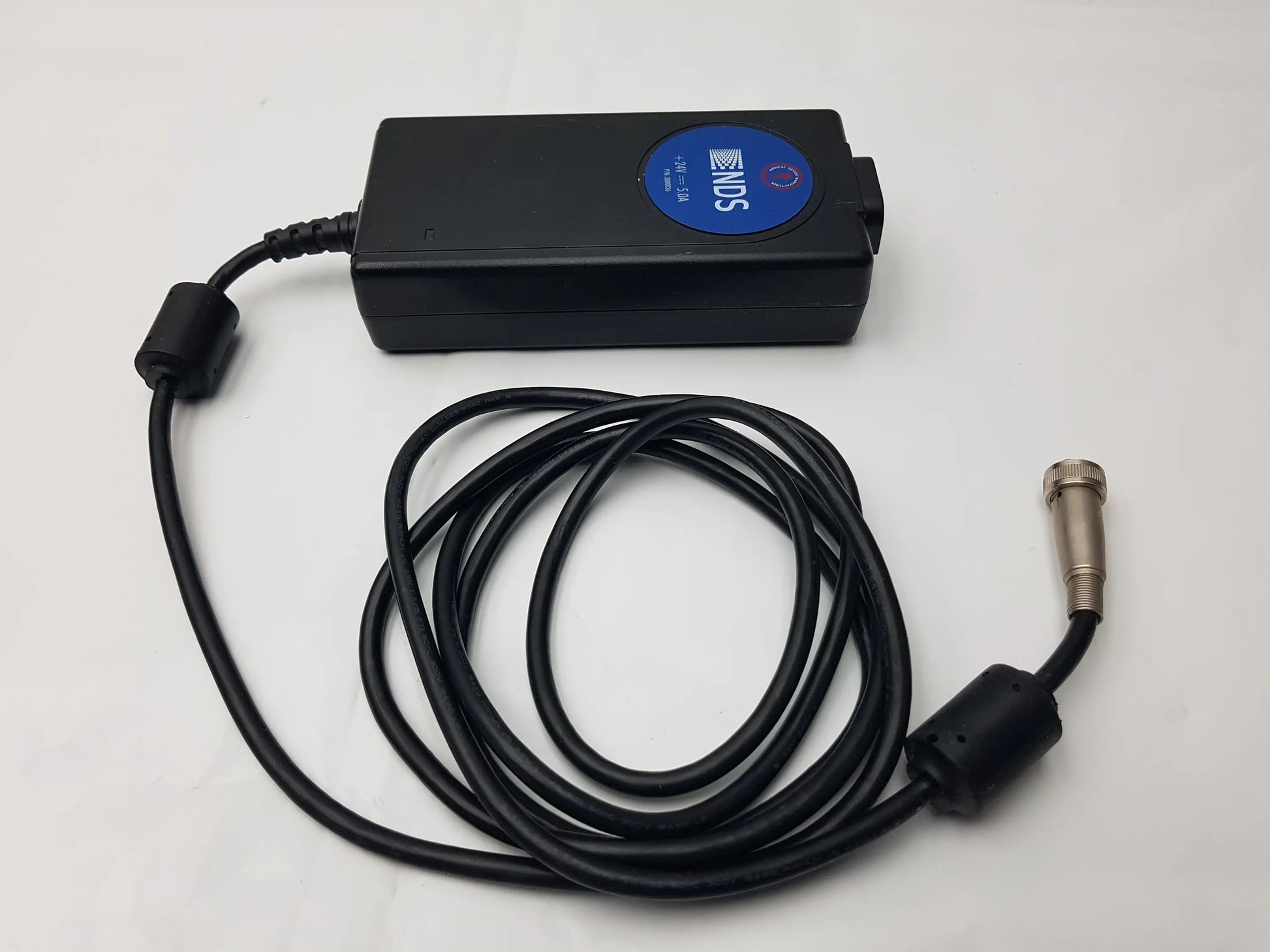 Black Philips NDS power supply with coiled cable and metallic connector for medical power supply MW155RA2400F02