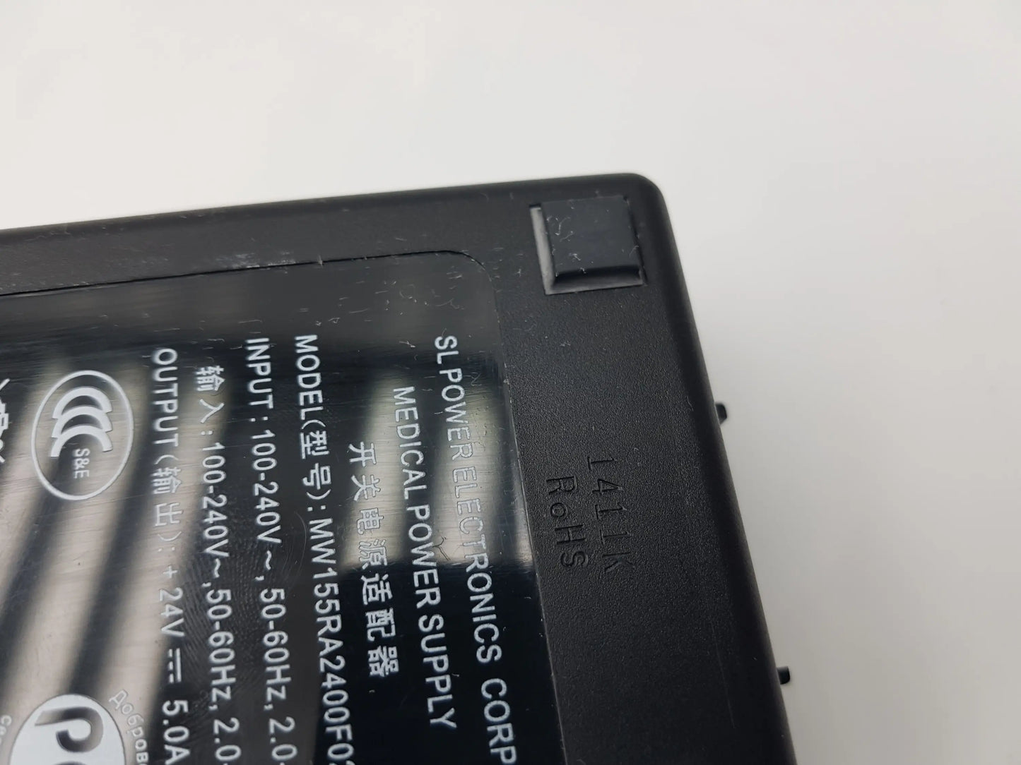 Black plastic medical power supply adapter model mw155ra2400f02 by sl power electronics for medical use