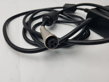 Black coiled power cable with silver 4-pin connector attached to sl power electronics mw155ra2400f02 medical power supply