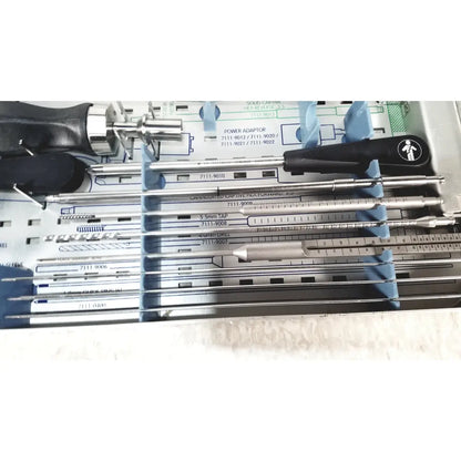 Smith & Nephew 5.5 mm cannulated screw set instrument tray with black and silver handles in a blue plastic set instrument tray