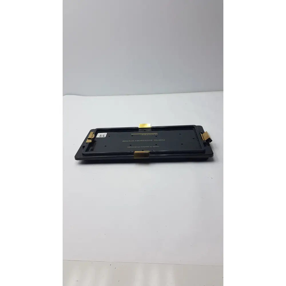 Black rectangular electronic endoscopy portal accessory with gold connectors for Smith & Nephew endoscopy portal system