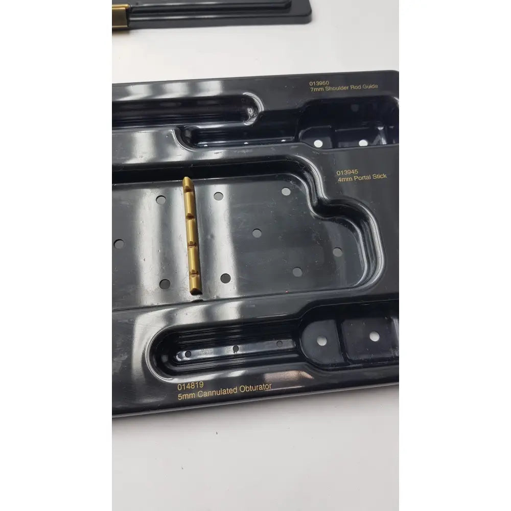 Gold-colored 5mm cannulated obturator with metallic finish and holes for nephew endoscopy portal accessory system 7207113