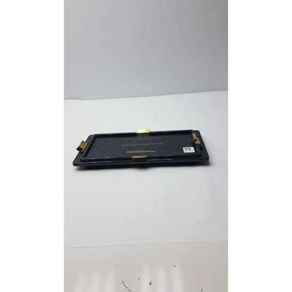 Black rectangular digital audio player with gold metallic accents and white 39 sticker for nephew endoscopy portal accessory system