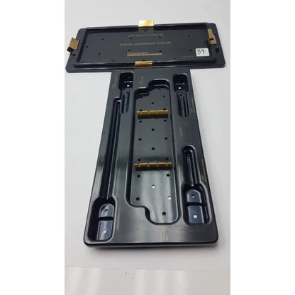 Black plastic smith and nephew endoscopy portal accessory system tray with gold metal components and molded slots